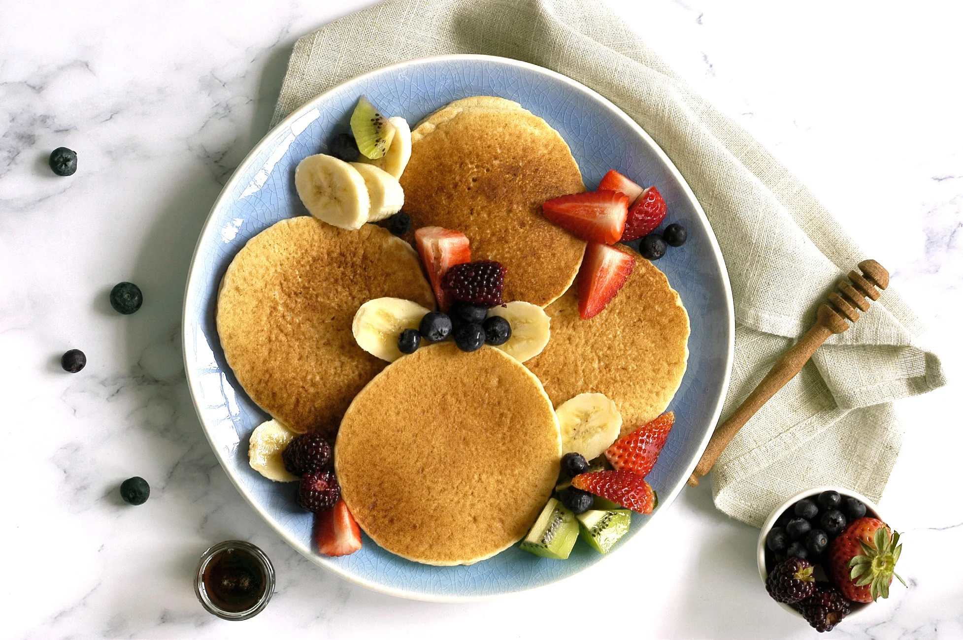 Seed pancakes with banana and berries